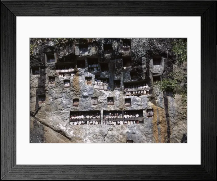 Framed Print : Effigies of the dead looking out from Lemo cliff tombs Framed Print : Effigies of the dead looking out from Lemo cliff tombs
