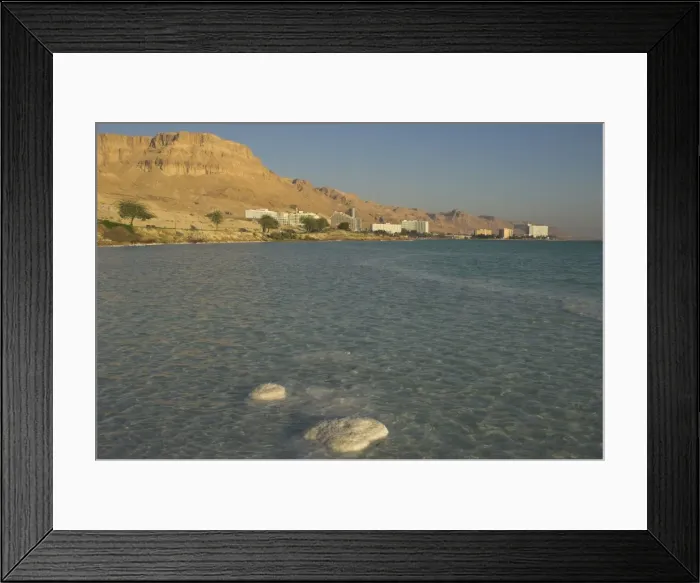 Framed Print : Salt blocks in the sea and hotels in background Framed Print : Salt blocks in the sea and hotels in background