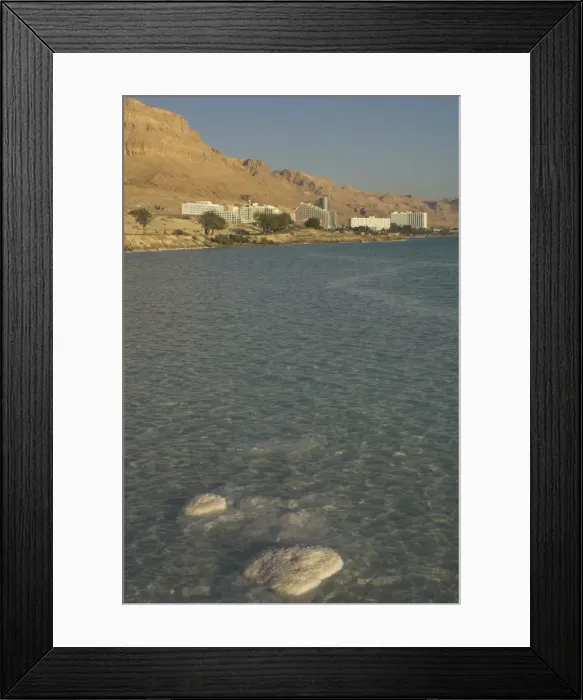 Framed Print : Salt blocks in the sea and hotels in background Framed Print : Salt blocks in the sea and hotels in background