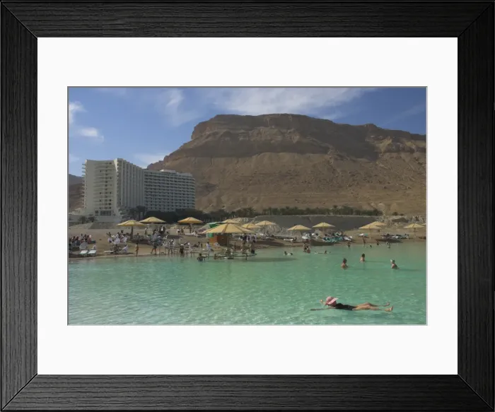 Framed Print : People floating in the sea and Hyatt hotel and desert Framed Print : People floating in the sea and Hyatt hotel and desert