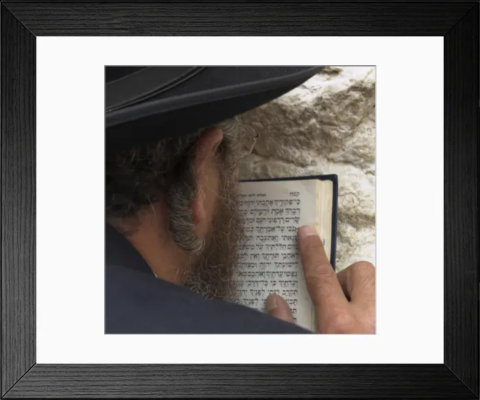 Framed Print : Close up of an Orthodox Jew holding prayer book against Framed Print : Close up of an Orthodox Jew holding prayer book against