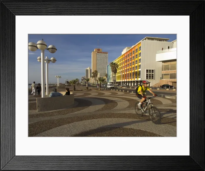 Framed Print : Cyclist on Jerusalem Beach Promenade with Dan hotel Framed Print : Cyclist on Jerusalem Beach Promenade with Dan hotel
