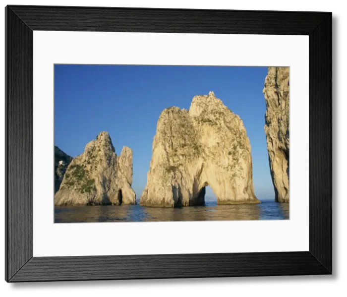 Framed Print : Rock arches known as the Faraglioni Stacks off Framed Print : Rock arches known as the Faraglioni Stacks off