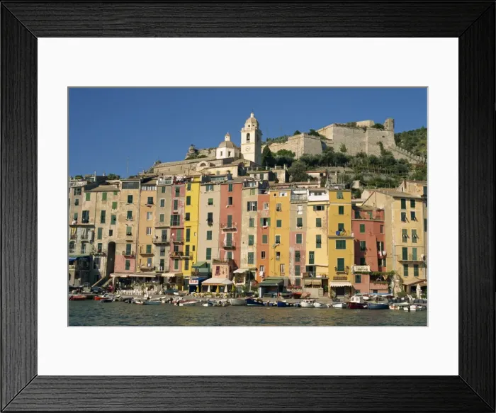 Framed Print : Tall painted houses on the waterfront at Portovenere in Liguria Framed Print : Tall painted houses on the waterfront at Portovenere in Liguria