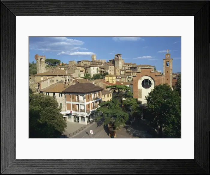 Framed Print : Houses, churches and towers in the town of Passignano