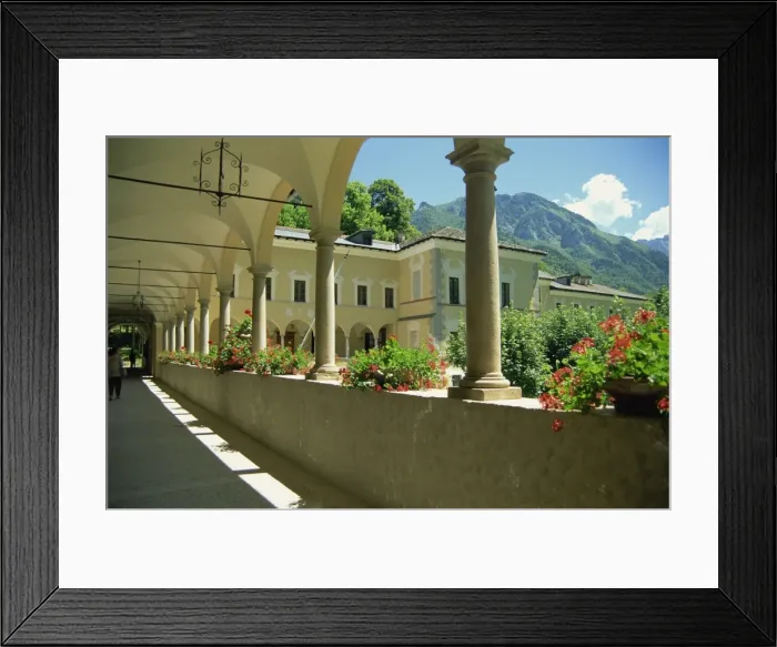 Framed Print : Geraniums and arches at the Certosa di Pesio in Piedmont