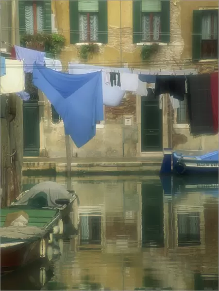 Laundry hung over canal to dry