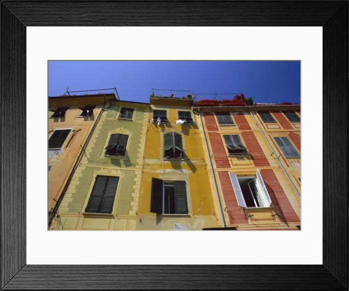 Framed Print : Colourful trompe l oeuil facades by the harbour Framed Print : Colourful trompe l oeuil facades by the harbour