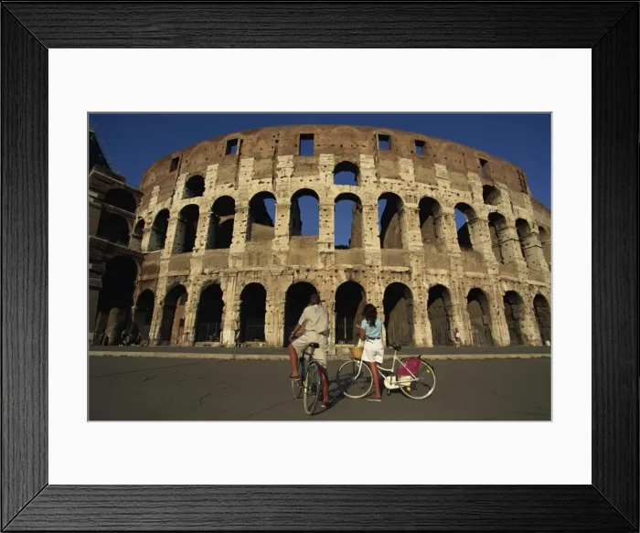 Framed Print : Couple admiring the Colosseum on bike ride Framed Print : Couple admiring the Colosseum on bike ride