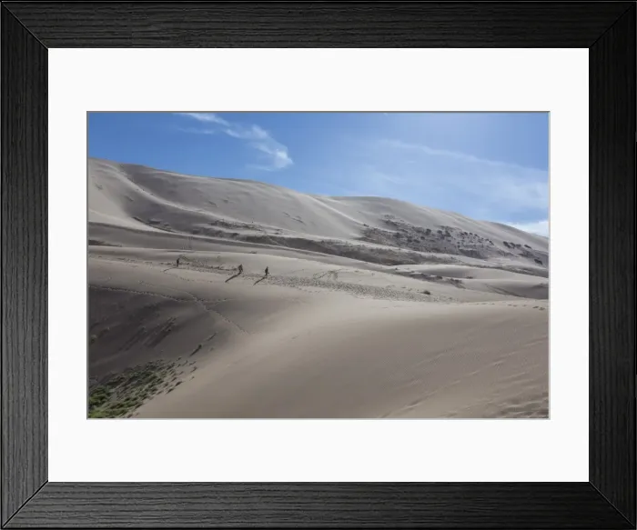 Framed Print : Distant people descending a huge sand dune, iridescent on a summer evening, Khongoryn Els Framed Print : Distant people descending a huge sand dune, iridescent on a summer evening, Khongoryn Els