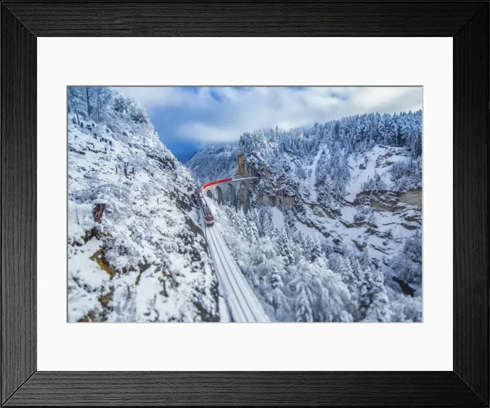 Framed Print : Bernina Express passes through the snowy woods around Filisur, Canton of Grisons (Graubunden) Framed Print : Bernina Express passes through the snowy woods around Filisur, Canton of Grisons (Graubunden)