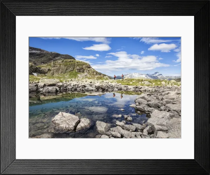 Framed Print : Hikers admire the view at Lake Grevasalvas, Engadine, Canton of Grisons (Graubunden)