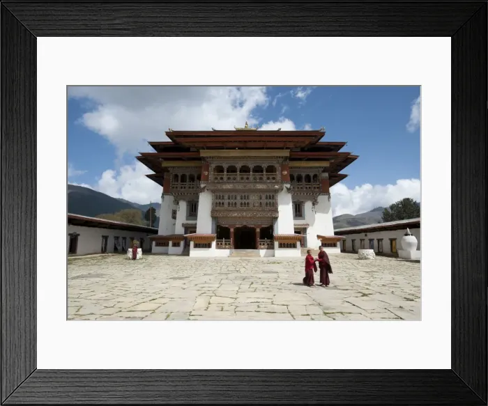 Framed Print : Buddhist monks in stone courtyard of Gangtey dzong (monastery), the largest Nyingmapa Framed Print : Buddhist monks in stone courtyard of Gangtey dzong (monastery), the largest Nyingmapa