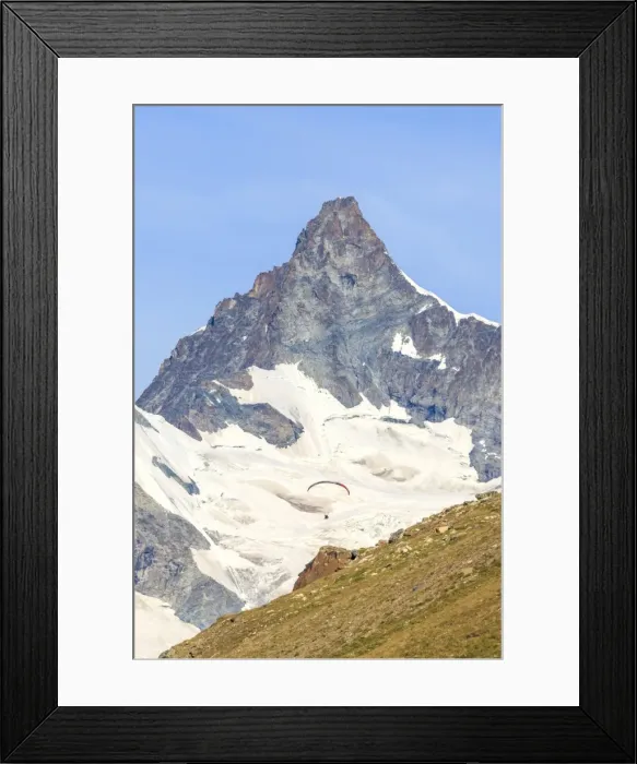 Framed Print : A paraglider flies in front of the majestic Obergabelhorn, Canton of Valais, Pennine Alps Framed Print : A paraglider flies in front of the majestic Obergabelhorn, Canton of Valais, Pennine Alps