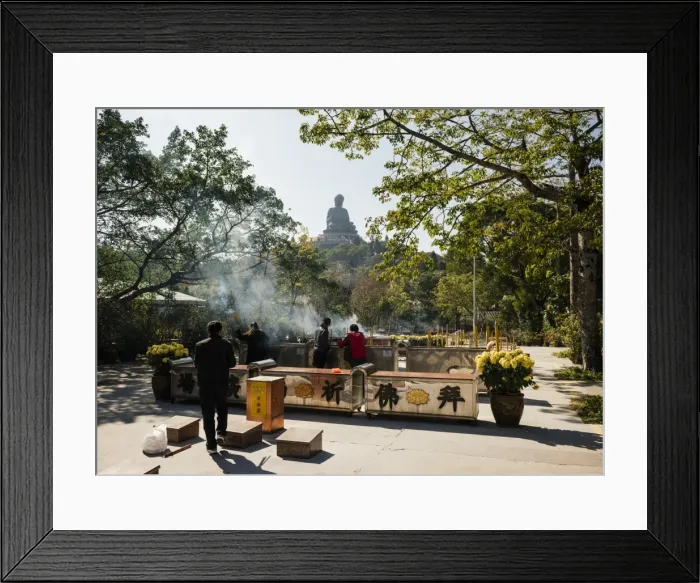 Framed Print : People lighting incense at Po Lin Monastery with Big Buddha statue in background Framed Print : People lighting incense at Po Lin Monastery with Big Buddha statue in background