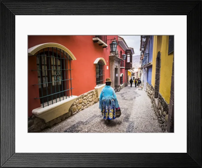 Framed Print : Chollita on Calle Jaen, a colourful colonial cobbled street in La Paz, La Paz Department Framed Print : Chollita on Calle Jaen, a colourful colonial cobbled street in La Paz, La Paz Department