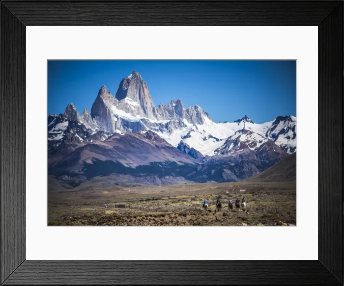 Framed Print : Gauchos riding horses and herding sheep with Mount Fitz Roy behind, UNESCO World Heritage Site Framed Print : Gauchos riding horses and herding sheep with Mount Fitz Roy behind, UNESCO World Heritage Site