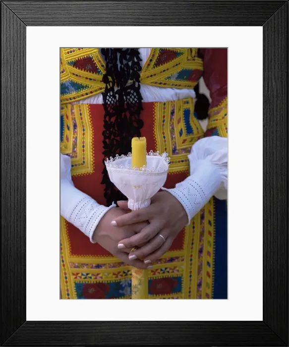 Framed Print : Close-up of woman holding a candle Framed Print : Close-up of woman holding a candle