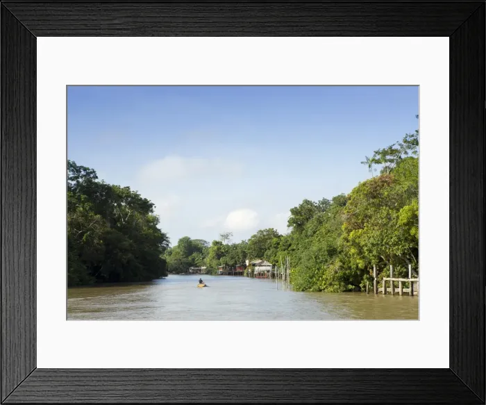 Framed Print : A boat on an igarape (flooded creek) in the Brazilian Amazon near Belem, Para, Brazil Framed Print : A boat on an igarape (flooded creek) in the Brazilian Amazon near Belem, Para, Brazil
