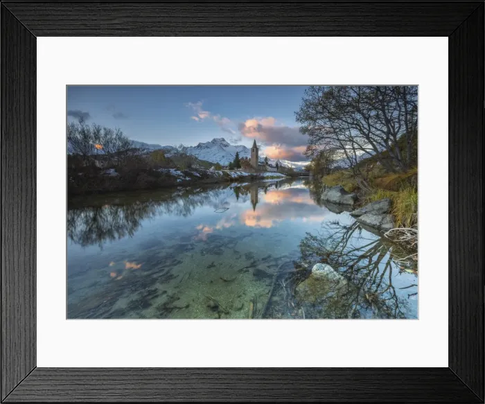 Framed Print : Dawn illuminates the snowy peaks and the bell tower reflected in Lake Sils, Engadine Framed Print : Dawn illuminates the snowy peaks and the bell tower reflected in Lake Sils, Engadine
