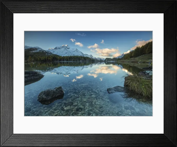 Framed Print : Dawn illuminates the snowy peaks reflected in the calm waters of Lake Sils, Engadine Framed Print : Dawn illuminates the snowy peaks reflected in the calm waters of Lake Sils, Engadine
