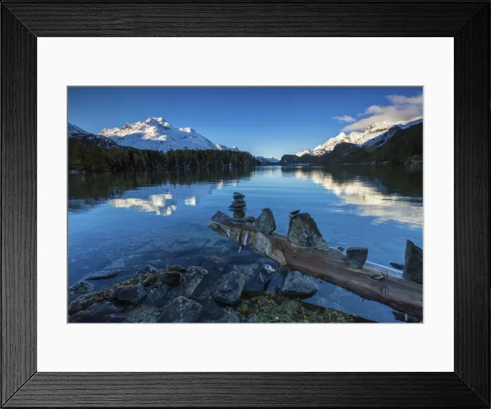 Framed Print : Dawn illuminates the snowy peaks reflected in the calm waters of Lake Sils, Engadine Framed Print : Dawn illuminates the snowy peaks reflected in the calm waters of Lake Sils, Engadine
