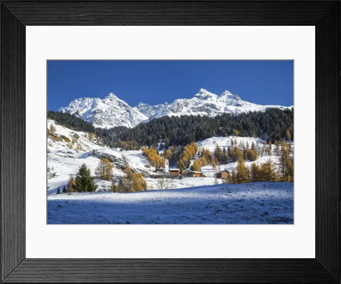 Framed Print : Snowy landscape and colorful trees in the small village of Sur, Val Sursette, Canton of Graubunden Framed Print : Snowy landscape and colorful trees in the small village of Sur, Val Sursette, Canton of Graubunden
