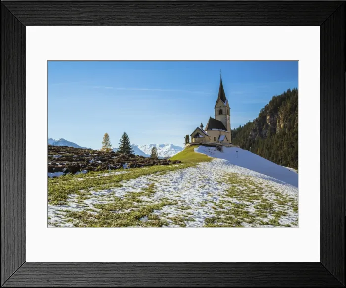 Framed Print : The church of the little village of Schmitten surrounded by snow, Albula District Framed Print : The church of the little village of Schmitten surrounded by snow, Albula District