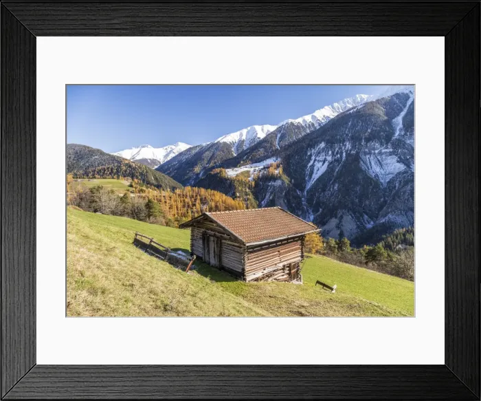 Framed Print : Wooden cabin surrounded by colorful woods and snowy peaks, Schmitten, Albula District Framed Print : Wooden cabin surrounded by colorful woods and snowy peaks, Schmitten, Albula District