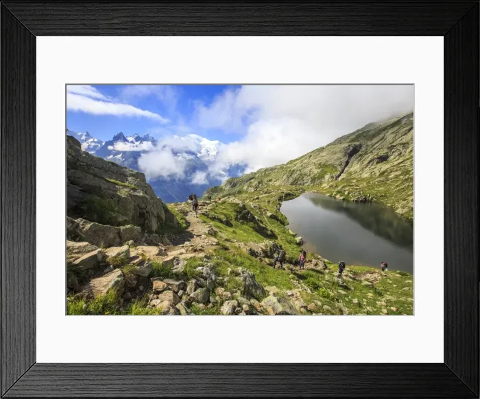Framed Print : Low clouds and mist around Grandes Jorasses and Mont Blanc while hikers proceed on Lac De Cheserys Framed Print : Low clouds and mist around Grandes Jorasses and Mont Blanc while hikers proceed on Lac De Cheserys