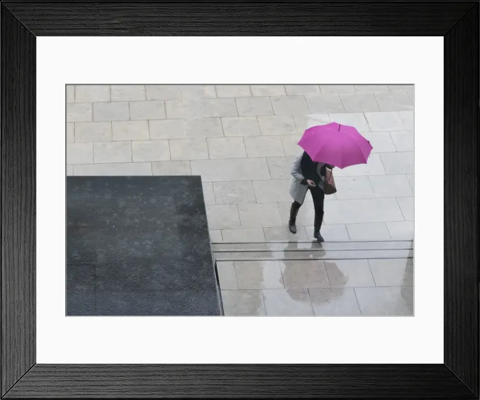 Framed Print : Woman with umbrella and mobile phone walking up steps to Auckland Art Gallery, Auckland