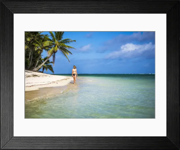 Framed Print : Woman walking along a tropical beach, Rarotonga Island, Cook Islands, South Pacific Framed Print : Woman walking along a tropical beach, Rarotonga Island, Cook Islands, South Pacific