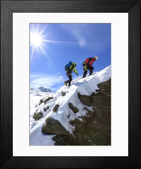 Framed Print : Climbers on the rocks with the snowy peaks of the Alps in the background, Stelvio Pass Framed Print : Climbers on the rocks with the snowy peaks of the Alps in the background, Stelvio Pass