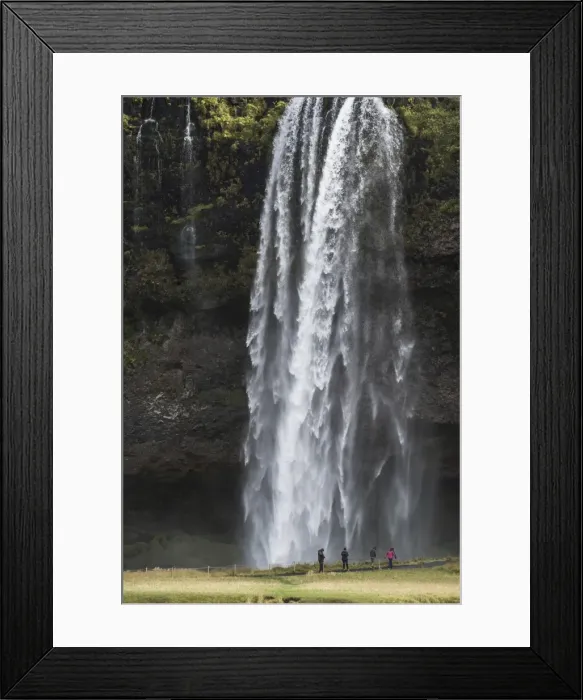Framed Print : Tourists at Seljalandsfoss, a famous waterfall just off route 1 in South Iceland (Sudurland)