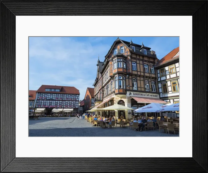 Framed Print : Half-timbered houses and cafe on the market square, Wernigerode, Harz, Saxony-Anhalt Framed Print : Half-timbered houses and cafe on the market square, Wernigerode, Harz, Saxony-Anhalt