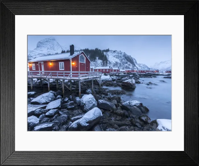 Framed Print : Typical fishermen houses called rorbu in the snowy landscape at dusk, Nusfjord, Nordland County Framed Print : Typical fishermen houses called rorbu in the snowy landscape at dusk, Nusfjord, Nordland County