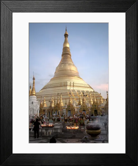 Framed Print : Candles placed by devotees at sunset in front of the golden Shwesagon Pagoda, a 2500 Framed Print : Candles placed by devotees at sunset in front of the golden Shwesagon Pagoda, a 2500