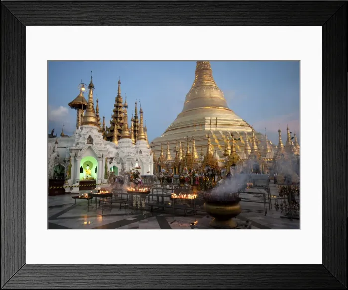 Framed Print : Lit candles placed by devotees at sunset at the Shwesagon Pagoda, a 2500 year old Framed Print : Lit candles placed by devotees at sunset at the Shwesagon Pagoda, a 2500 year old