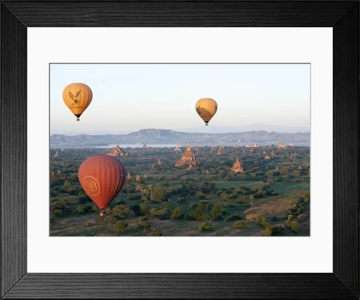 Framed Print : Hot air balloons flying over the terracotta temples of Bagan with the Irrawaddy river Framed Print : Hot air balloons flying over the terracotta temples of Bagan with the Irrawaddy river