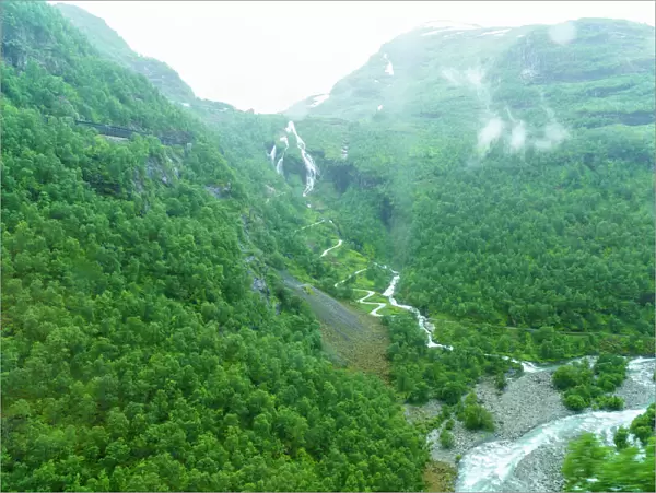 A view of waterfalls and forest from the Flam Railway, Flamsbana, Flam, Norway, Scandinavia