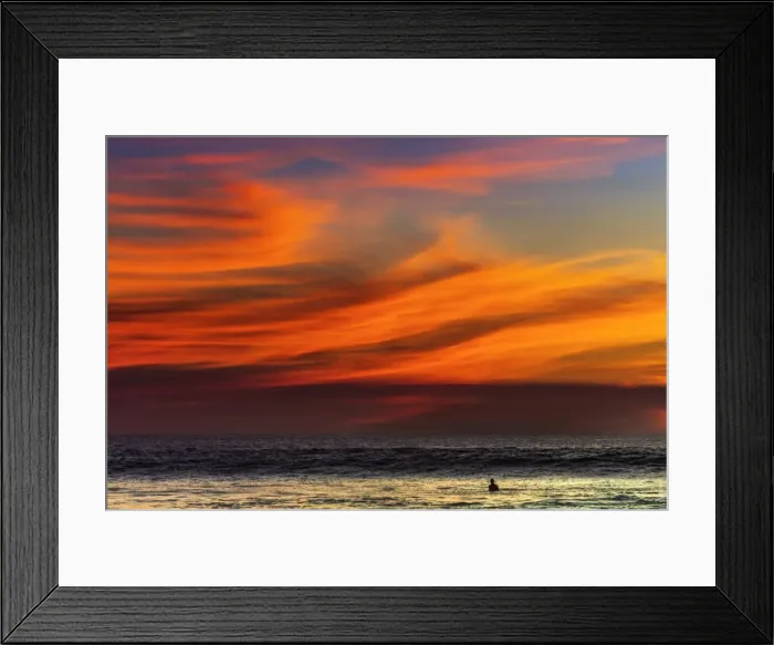 Framed Print : Lone surfer and sunset clouds off Playa Hermosa surf beach, southern Nicoya Peninsula