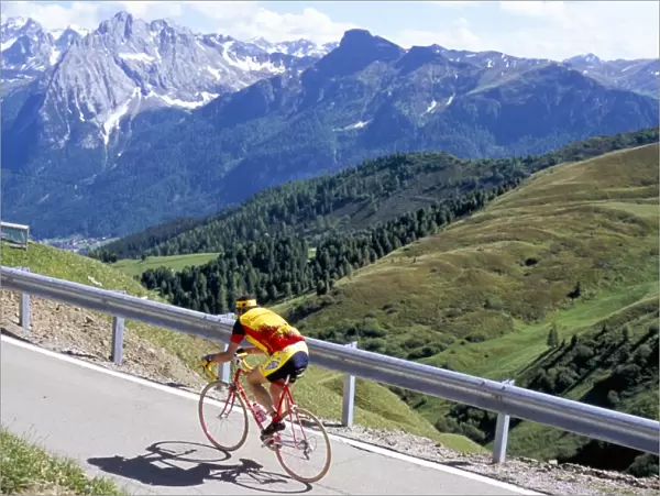 Cyclist riding over Sella Pass