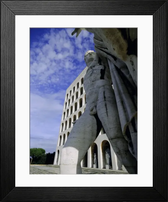 Framed Print : Statue with the Palazzo della Civilta di Lavoro behind Framed Print : Statue with the Palazzo della Civilta di Lavoro behind