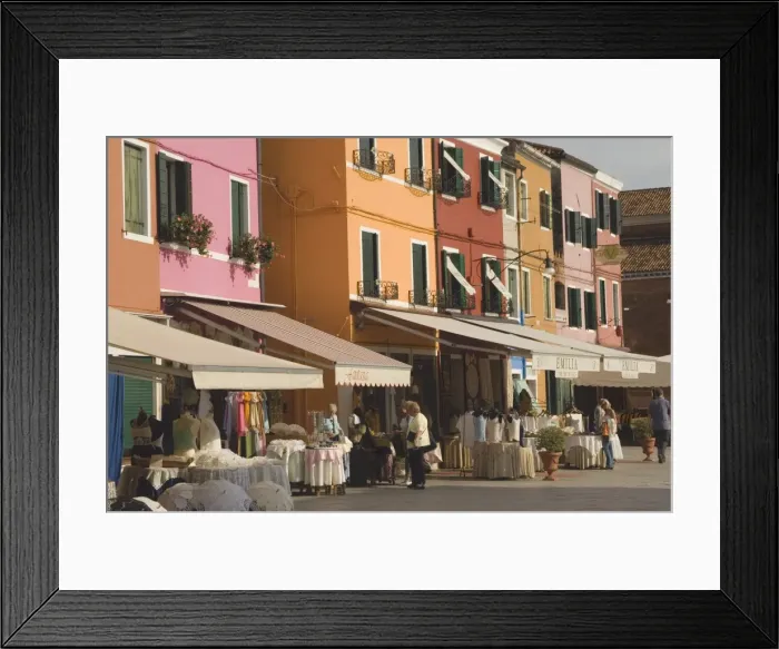 Framed Print : Coloured shopfront houses with pavement displays Framed Print : Coloured shopfront houses with pavement displays