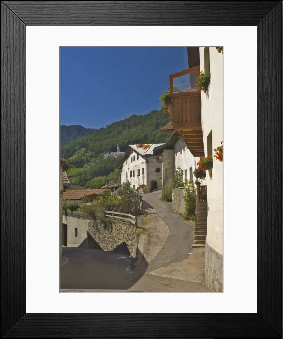 Framed Print : Old houses in village street in Burgusio