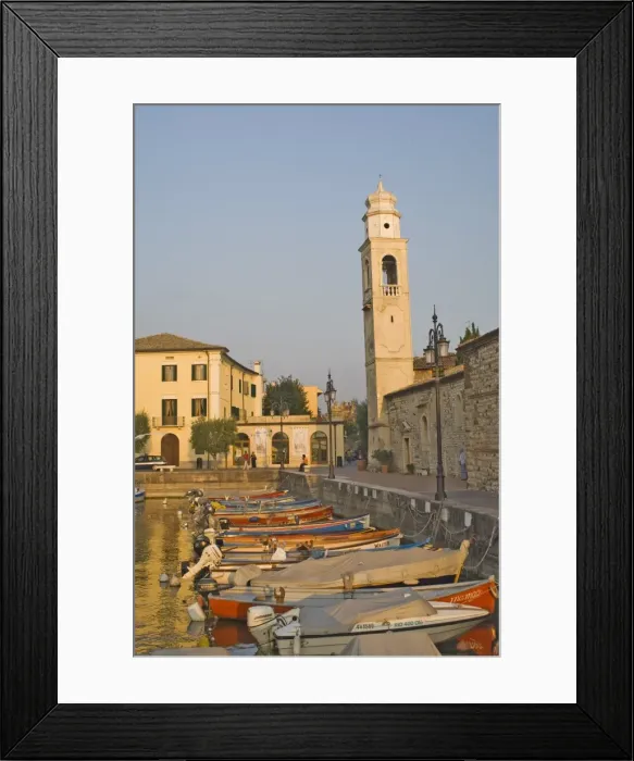 Framed Print : Evening light over the harbour and campanile at Lazise Framed Print : Evening light over the harbour and campanile at Lazise