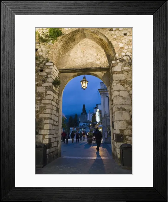 Framed Print : Gateway into town at night