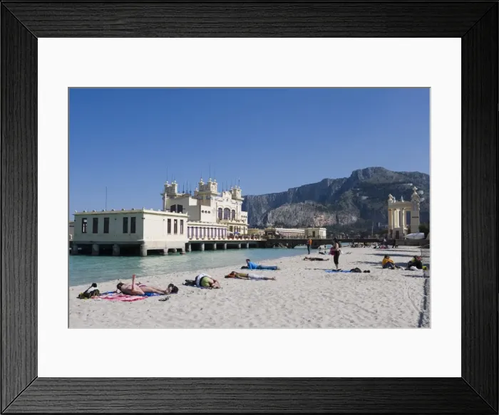 Framed Print : Sunbathers on beach near the pier Framed Print : Sunbathers on beach near the pier