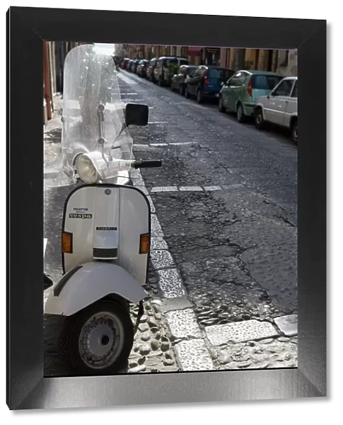 Motor scooter parked on street