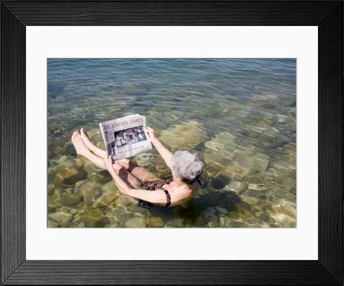 Framed Print : Reading newspaper floating in Dead Sea Framed Print : Reading newspaper floating in Dead Sea